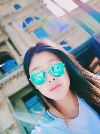 Portrait of young woman wearing sunglasses