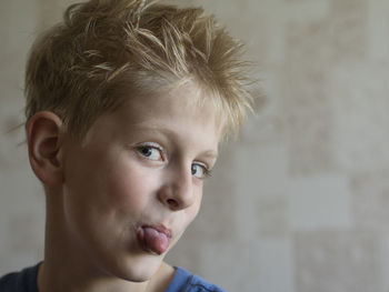 Close-up portrait of boy at home