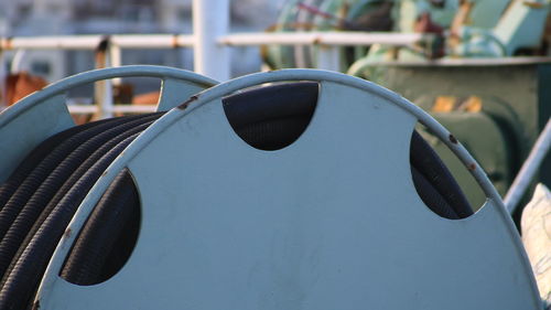 Close-up of sunglasses against blue sky on sunny day