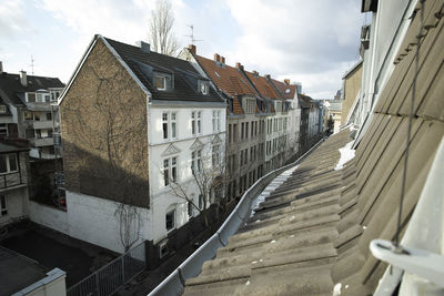 High angle view of street and buildings against sky