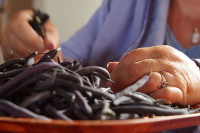 Close-up of people working on table