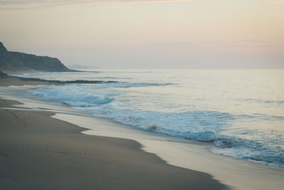 Scenic view of beach against sky