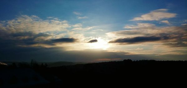 Silhouette of landscape against sunset sky