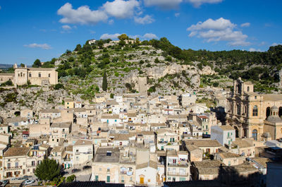 High angle view of townscape against cloudy sky