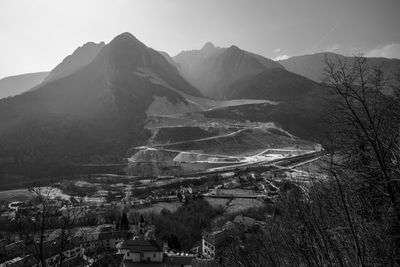 High angle view of townscape and mountains against sky