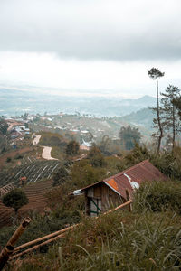 Houses and buildings against sky