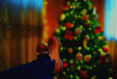Low section of man wearing shoes