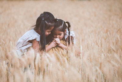 Mother and daughter on field