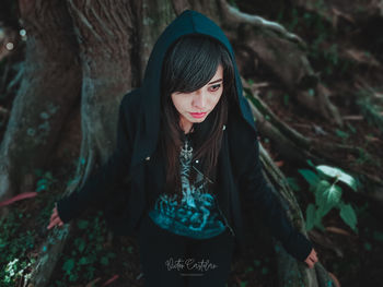 Portrait of a beautiful young woman in forest