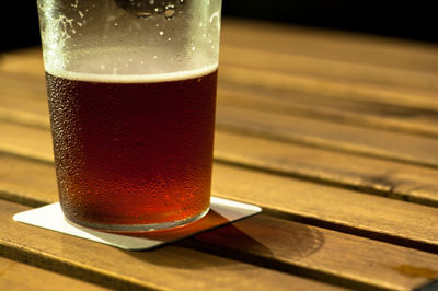 Close-up of cropped drink on table