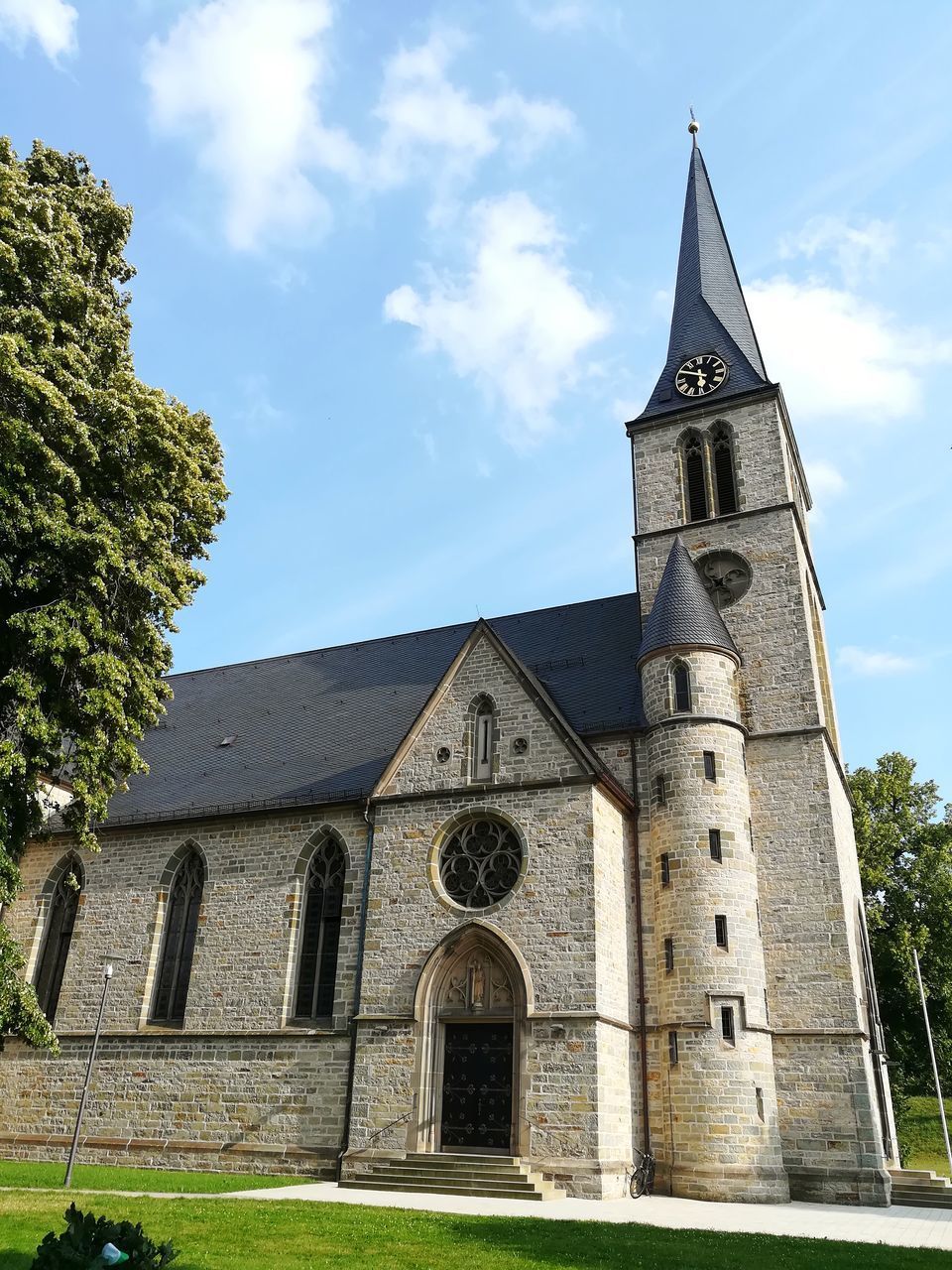 LOW ANGLE VIEW OF CHURCH AGAINST BUILDING