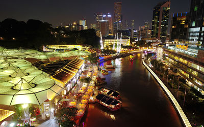 High angle view of city lit up at night