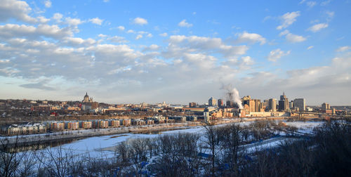 Buildings in city against sky