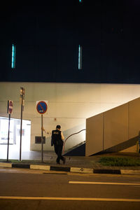 Man walking by basketball court