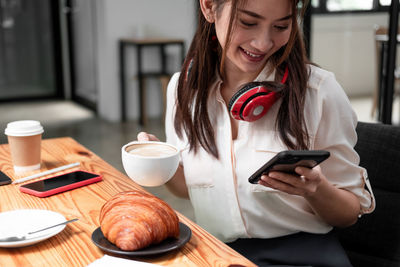 Young woman using mobile phone