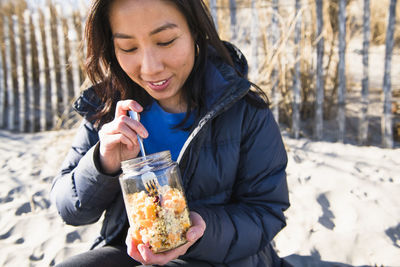 Closeup of asian woman with zero waste homemade plant based lunch