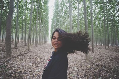 Portrait of young woman in forest