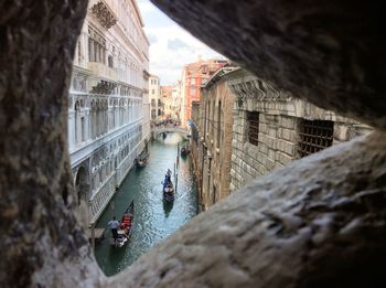 High angle view of people on gondolas sailing in canal