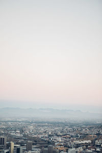 Aerial view of a city against sky