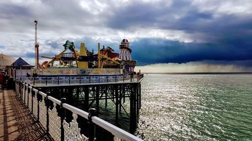 Pier by sea against sky