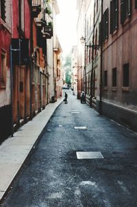 Narrow street along buildings