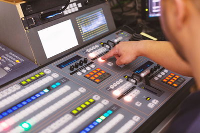 Close-up of man using sound mixer 