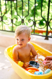 Portrait of shirtless boy sitting