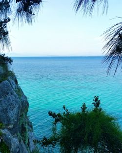 Scenic view of sea against clear blue sky