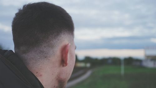 Close-up of man against sky