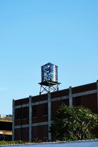 Low angle view of built structure against clear blue sky