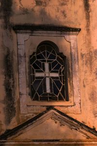 Low angle view of window on old building