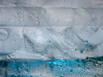 Full frame shot of wet glass in swimming pool