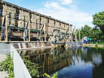 View of bridge over canal against sky