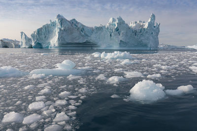 Scenic view of frozen lake against sky during winter