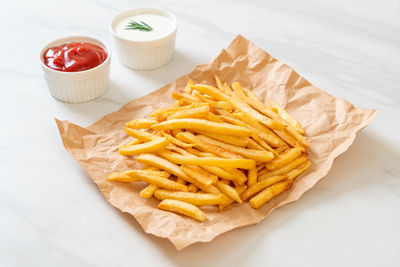 Close-up of french fries on table