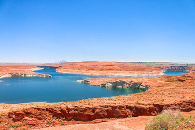 Scenic view of sea against blue sky