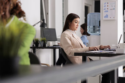 Female doctor working on table