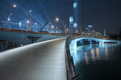 Illuminated bridge at night