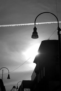 Low angle view of street light against sky