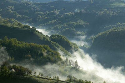 Scenic view of waterfall against sky