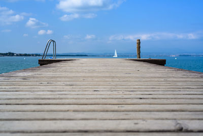 Pier over sea against sky