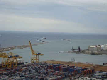 High angle view of harbor by sea against sky