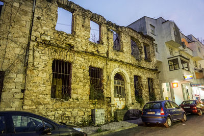 Cars on street amidst buildings in city