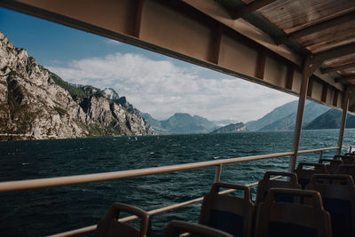 Scenic view of sea and mountains against sky
