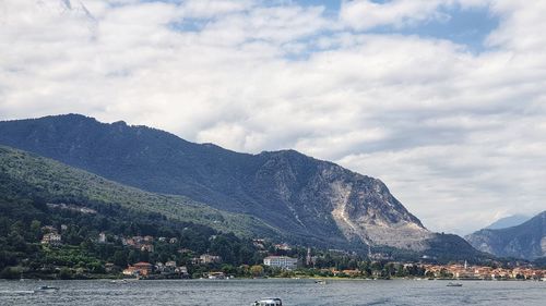 Scenic view of lake against cloudy sky