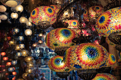 Close-up of illuminated lanterns for sale in market