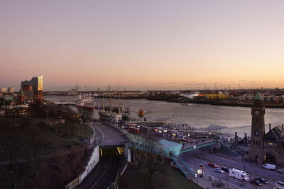 High angle view of bridge over river against sky at sunset