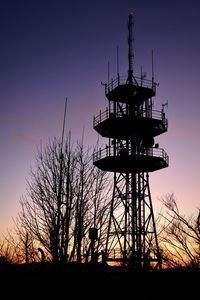 Silhouette of tower against sky during sunset