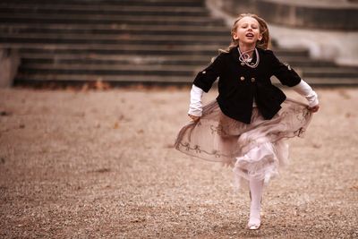 Girl running on footpath