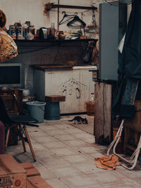 Chairs and table in abandoned building